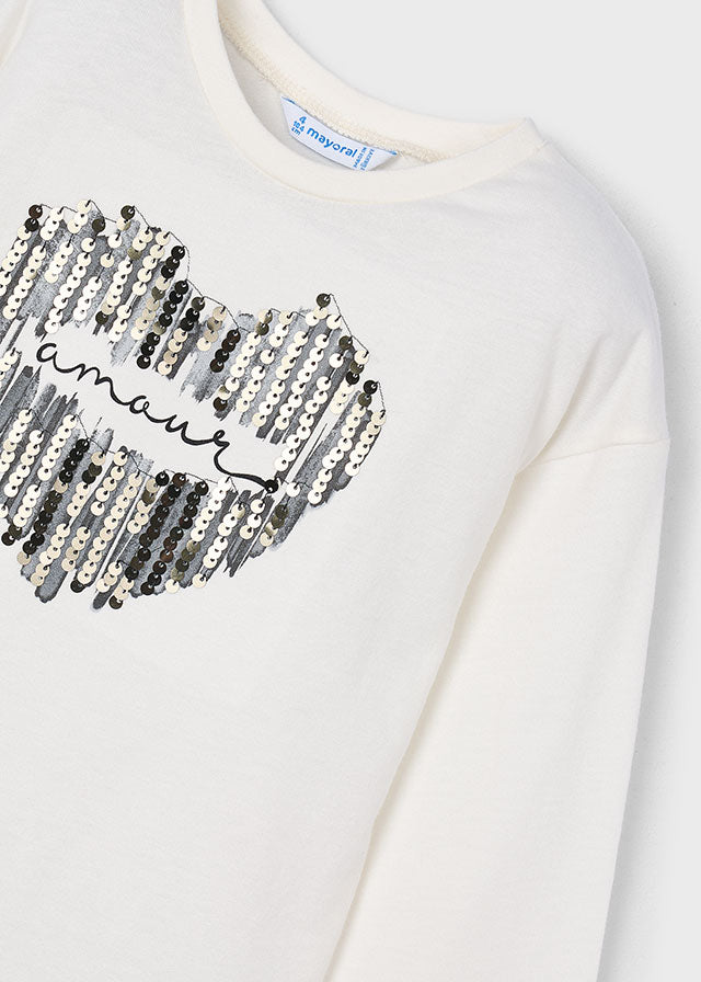 Camisola de manga comprida com coração de lantejoulas para menina Mayoral em Cru e Preto - detalhe